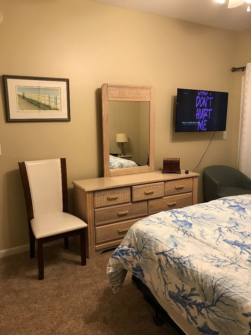 The Primary bedroom is complete with a triple dresser to hold all your clothes.