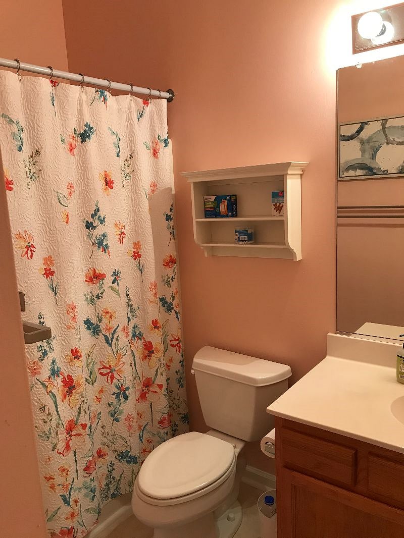 The Ensuite to the Primary bedroom has lots of storage, a large mirror in addition to a makeup mirror