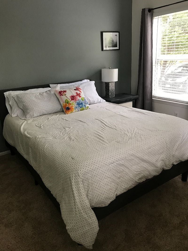 The Second Bedroom is also furnished with a Queen sized bed, a night table and lamp.  A small dresser and a large closet.