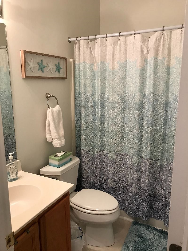 The Second Bathroom has a step in tub/shower with a showerhead with a handheld sprayer