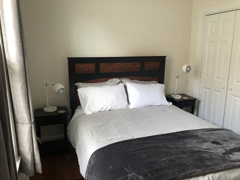2nd Bedroom with blackout curtains and air conditioner