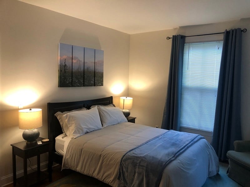 First Bedroom with blackout curtains and air conditioning