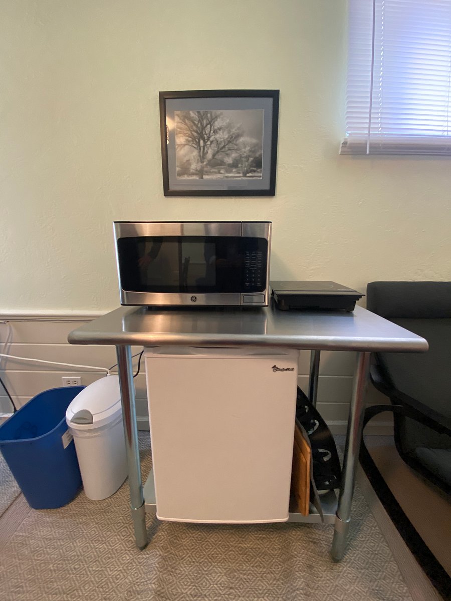 Fridge, microwave, cooktop, kettle, coffee maker. 
