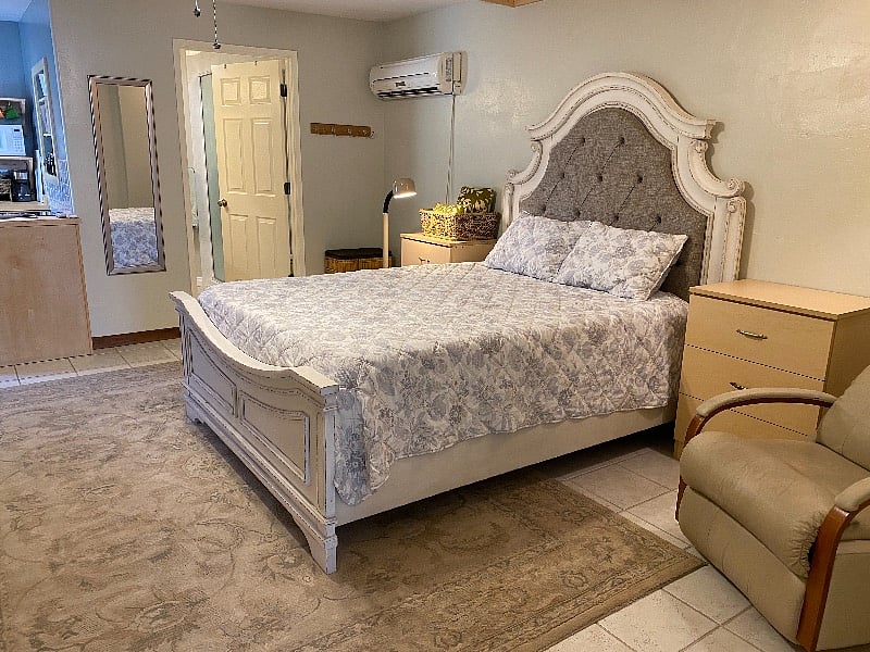 Queen-sized bed with memory foam mattress.