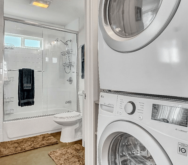Bathroom with shower and with multi-setting massage shower head. Washer/dryer.
