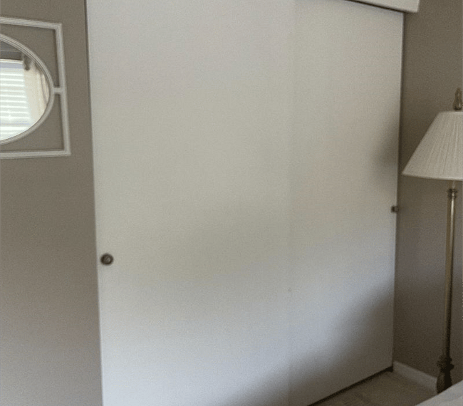 Large closet complete with a shelf and hangers. 