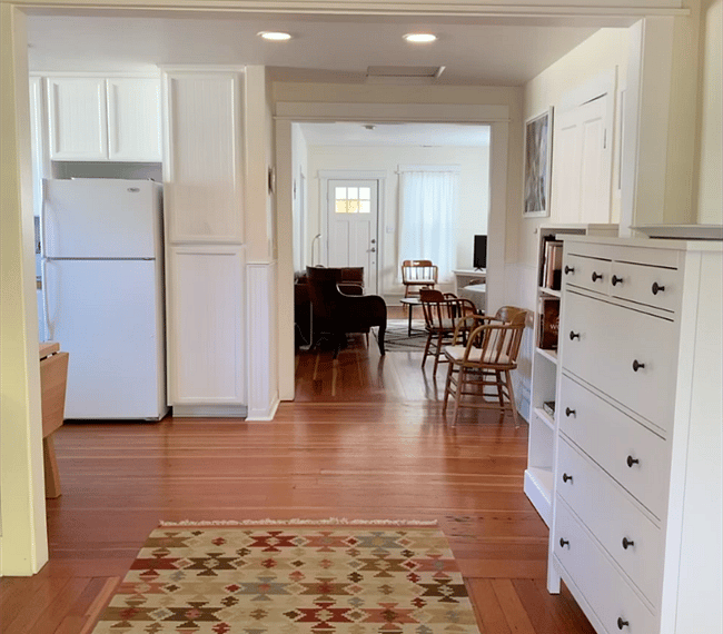 A full size refrigerator in the kitchen.