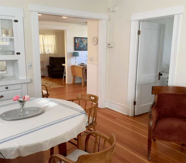 The dining table is close to the kitchen for easy access.