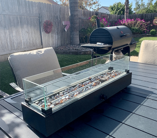 Outside patio area includes a table firepit. 