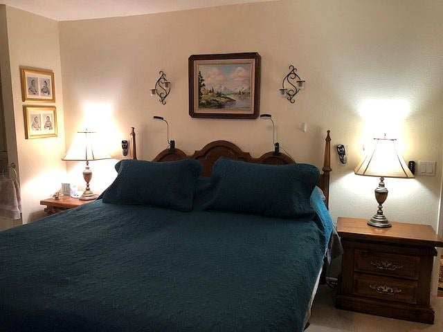Master Bedroom with king size bed and ceiling fan/light