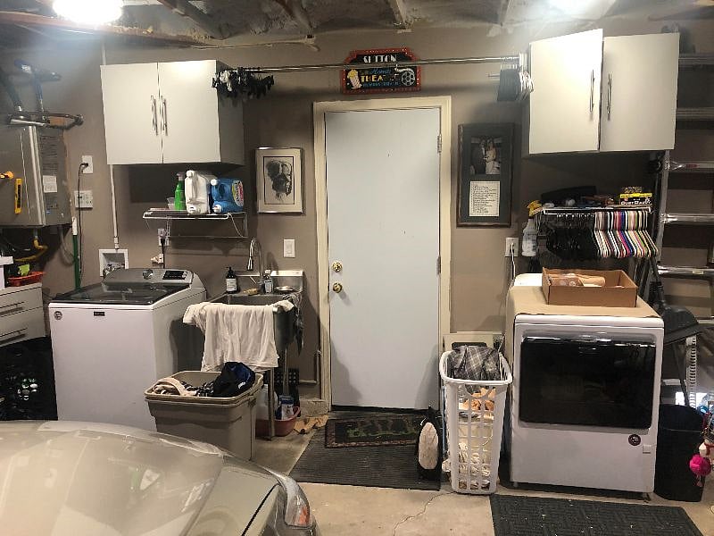 Washer Dryer and Stainless Laundry Sink conveniently located in attached garage