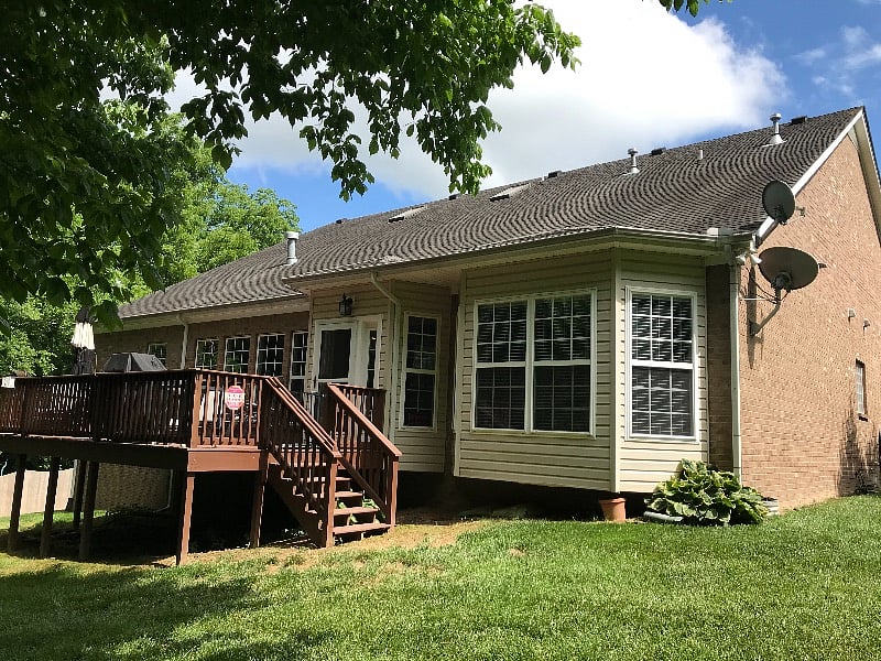- back deck with barbecue
- deck has table with umbrella, 4 swivel cars, 3 lounges
- house backs up to green space