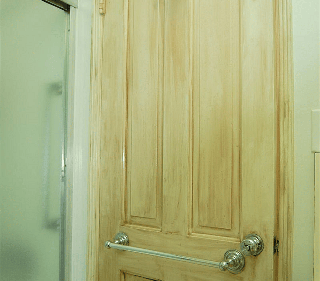 Back of bath door with towel bar and robe hook