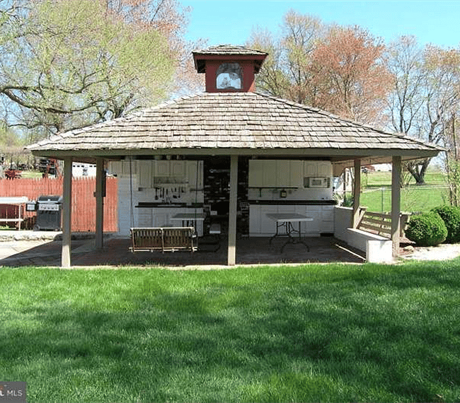 Outdoor kitchen area near pool 