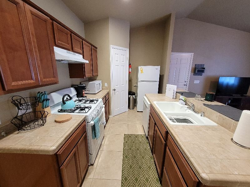 This kitchen is fully stocked and ready to take on your cooking appetite and walk-in pantry to easily access your food.