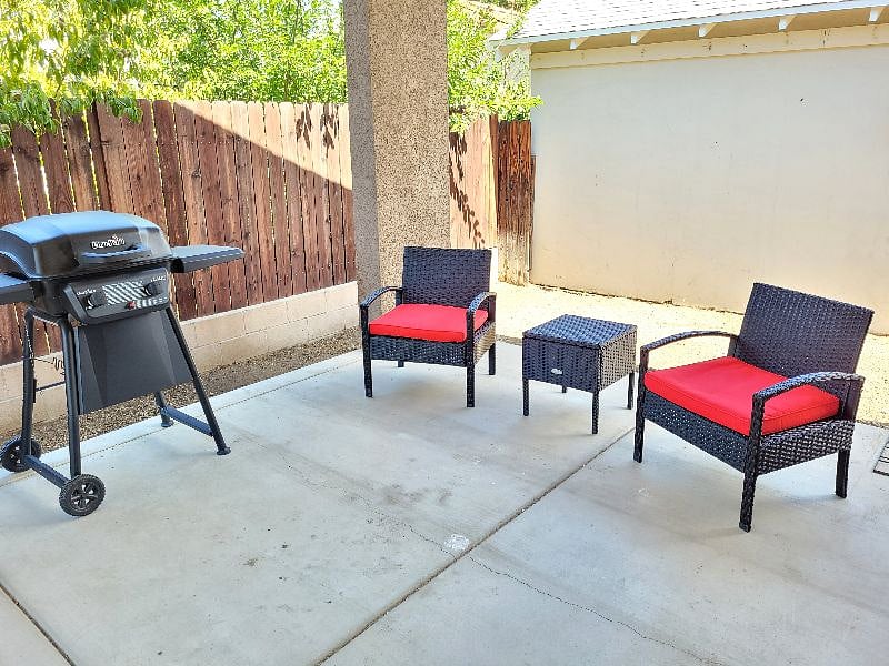 Enjoy the outdoor breeze in this shaded seating area while you grill your favorite food.