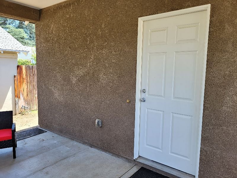 The door is conveniently located in the lit up carport to ensure you're not exposed to the outside elements.