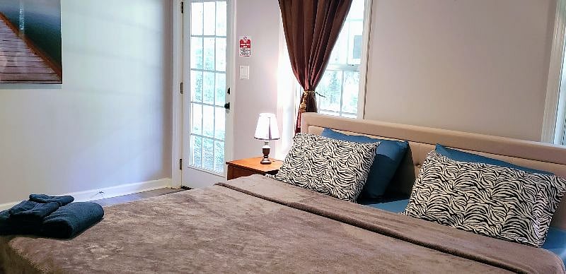 Huge Bedroom with KING size bed and top notch memory foam mattress for your comfort. Your very own extra large spacious walk in closet.
Room is set up with iron & iron board, plus shoe racks and laundry divider cart.
