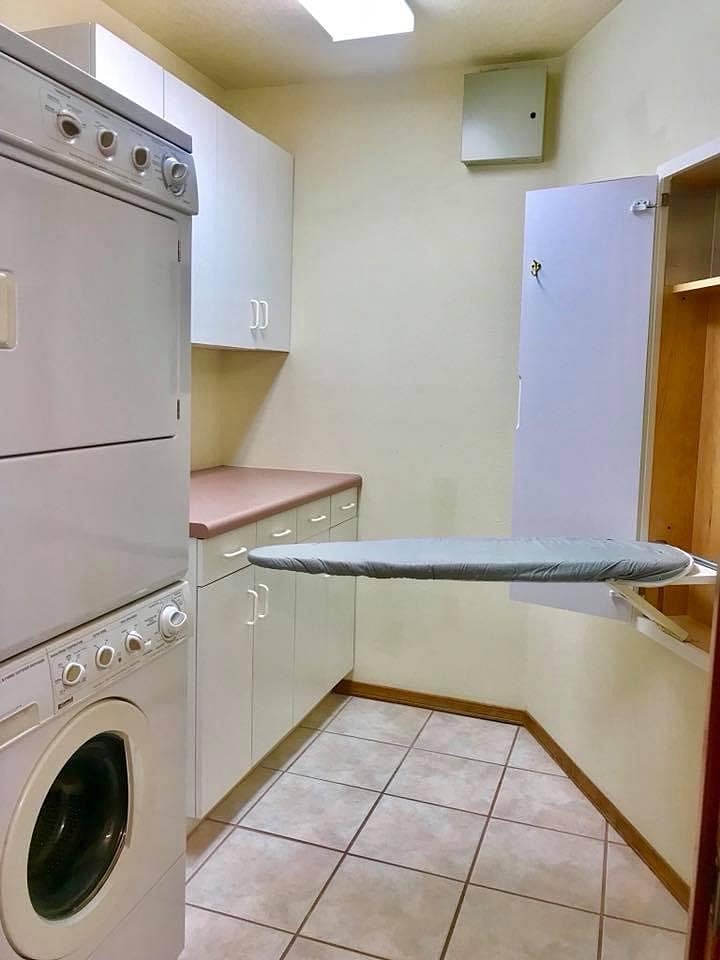 Washer and dryer with built in ironing board.