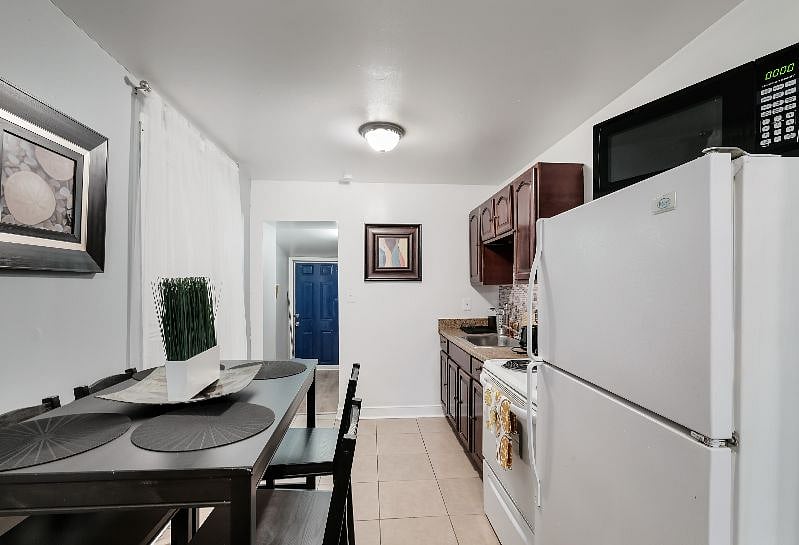 Modern new dining area with seating for 4 plus extra chairs on site, tall seating type.