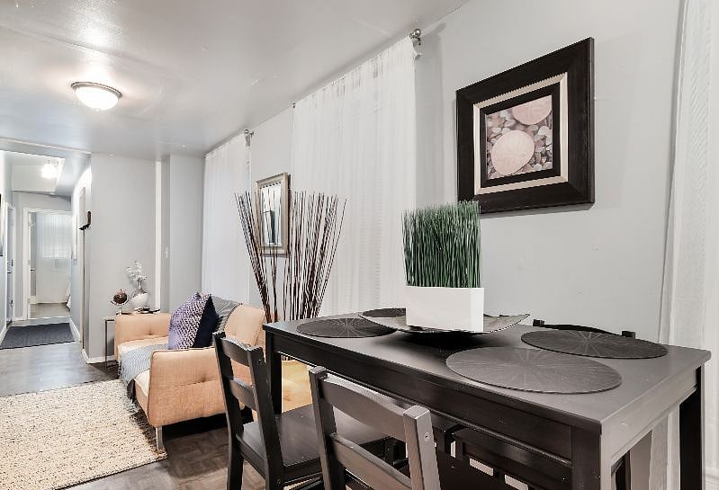 Modern new dining area with seating for 4 plus extra chairs on site, tall seating type.