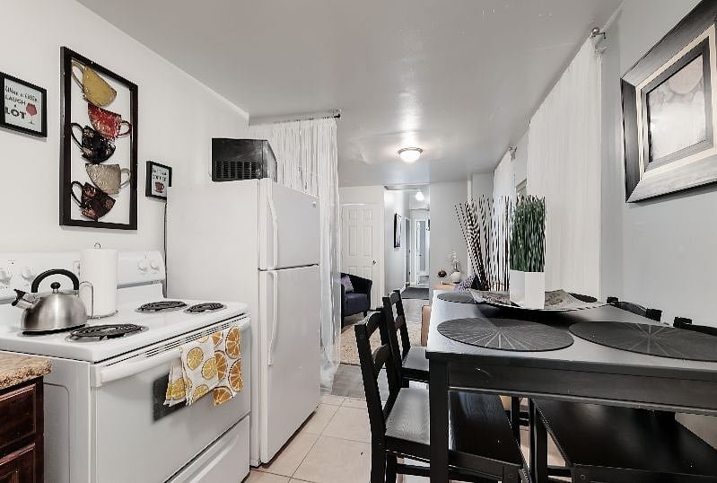 Modern new dining area with seating for 4 plus extra chairs on site, tall seating type.