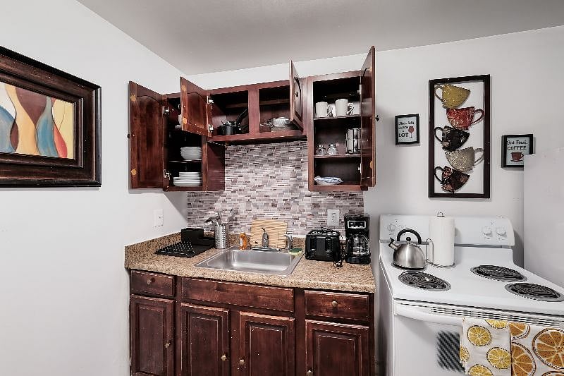 Fully stocked kitchen with all appliances, microwave, toaster, coffee maker, oven, stove, fridge freezer and all flatware, cookware and utensils.B