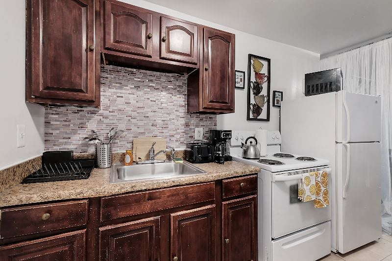 Fully stocked kitchen with all appliances, microwave, toaster, coffee maker, oven, stove, fridge freezer and all flatware, cookware and utensils.B
