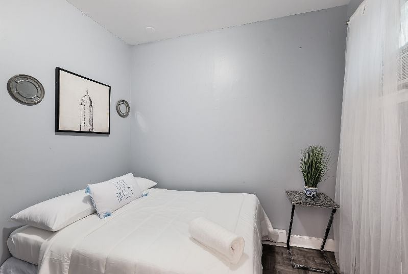 2nd Bdrm on the main level has a full bed, closet space, AC, windows for fresh air and private doorway, large room.