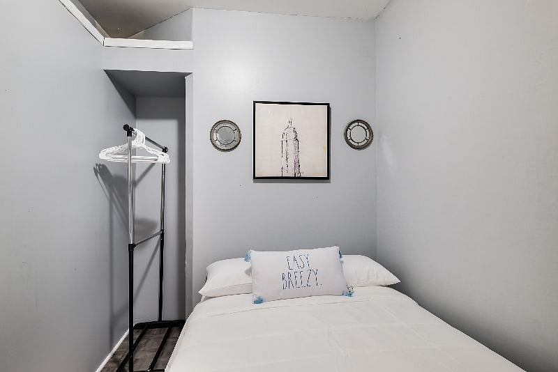 2nd Bdrm on the main level has a full bed, closet space, AC, windows for fresh air and private doorway, large room.
