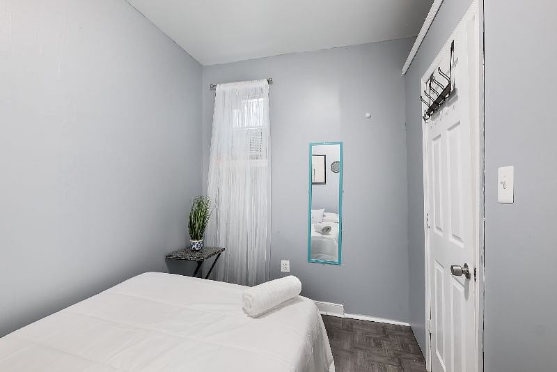 2nd Bdrm on the main level has a full bed, closet space, AC, windows for fresh air and private doorway, large room.