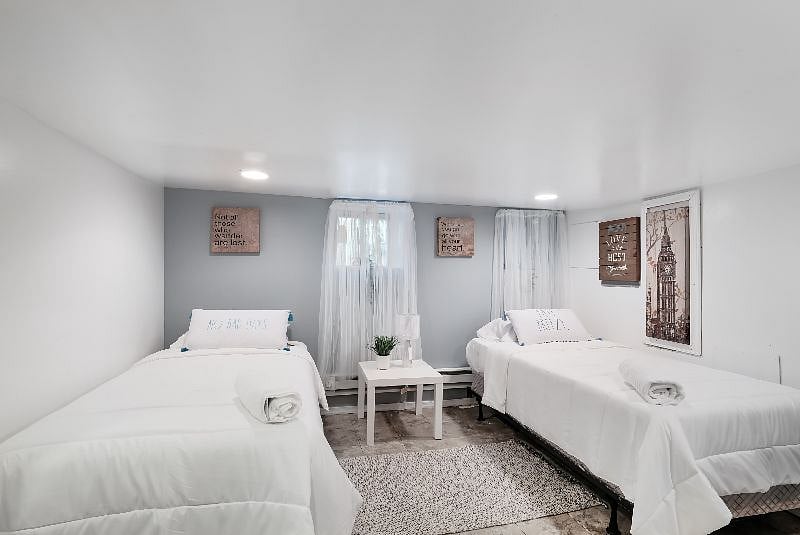 3rd Bdrm located on the lower level has two single beds, private doorway, storage space and its a very large room. Great place for peaceful sleep