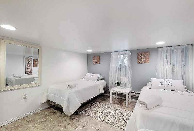 3rd Bdrm located on the lower level has two single beds, private doorway, storage space and its a very large room. Great place for peaceful sleep