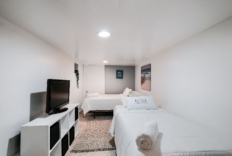 4th Bedroom is on the lower level also has 2 single beds, storage space and very private for good rest time