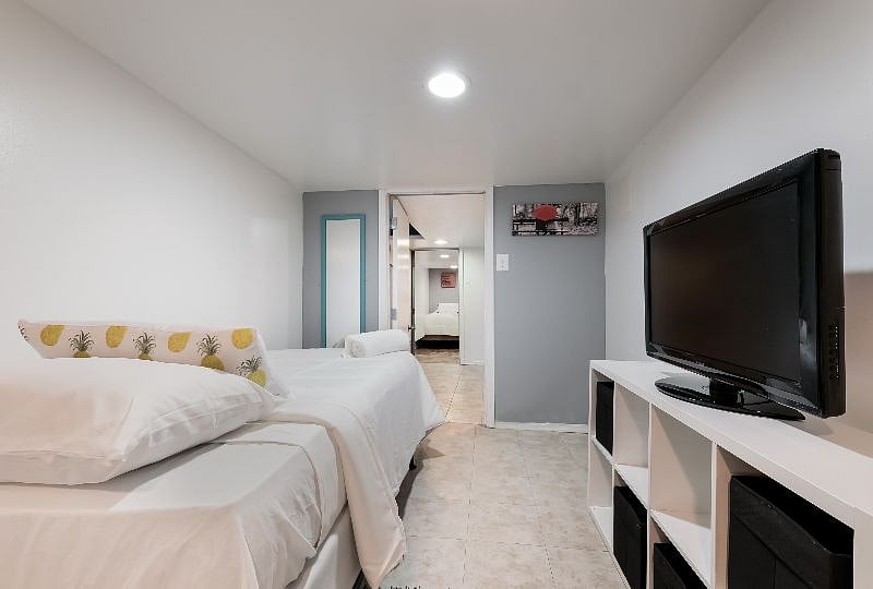 4th Bedroom is on the lower level also has 2 single beds, storage space and very private for good rest time