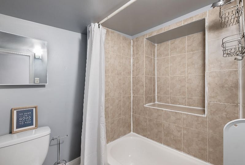 Bathroom is on the main level with shower and tub installation, toilet, vanity and ready for use.