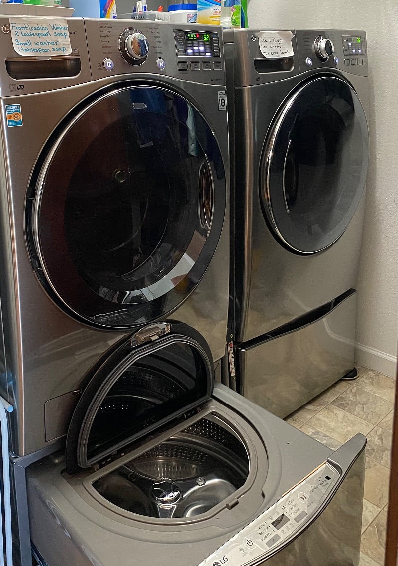 Laundry room with full size washer,  dryer and mini washer.