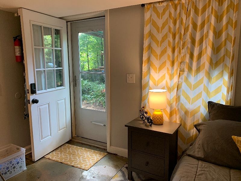 Private entrance with dual storm/screen door.