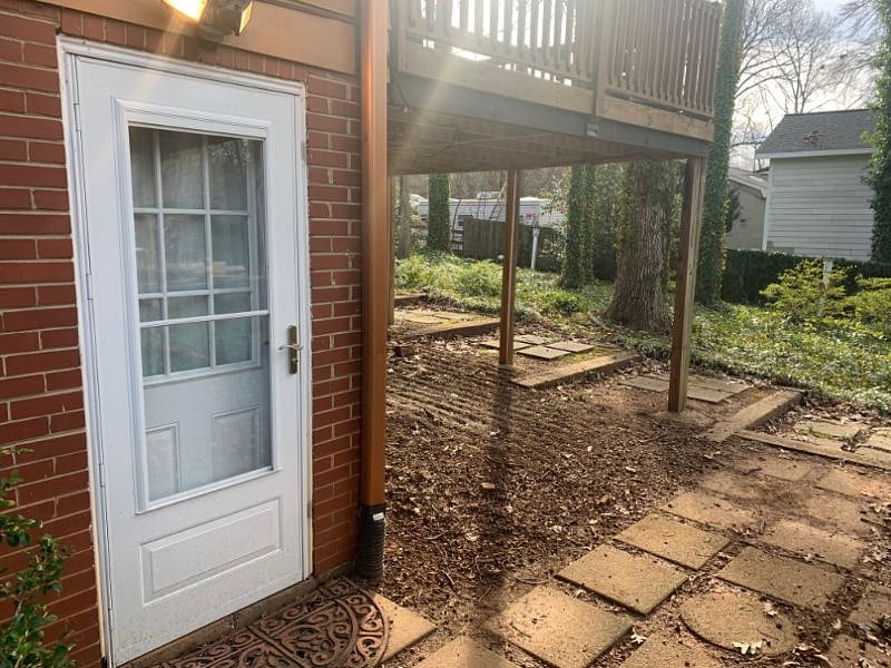 Private entrance from terraced steps.
