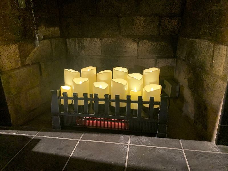 Electric candle unit gives mood lighting, additional quartz heat with blower - with or without candle light. 