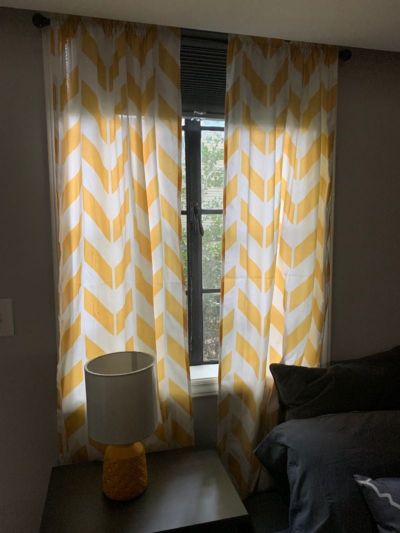 Windows with drapes for sun.