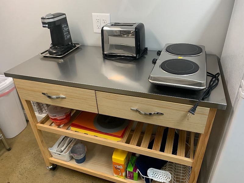 K-cup coffeemaker, toaster and dual quartz burners. Drawers provide cooking and eating utensils.