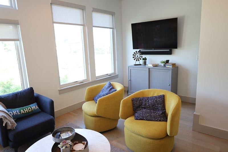Yellow chairs swivel to face the TV for game day or movie night!