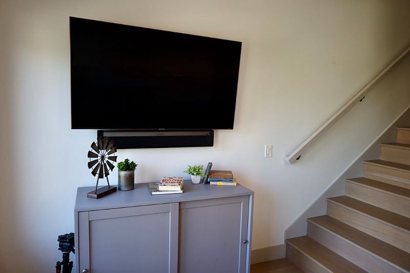 55" smart TV with Sonos Sound Bar in the living room. (Another 44" smart TV is mounted in bedroom 1).