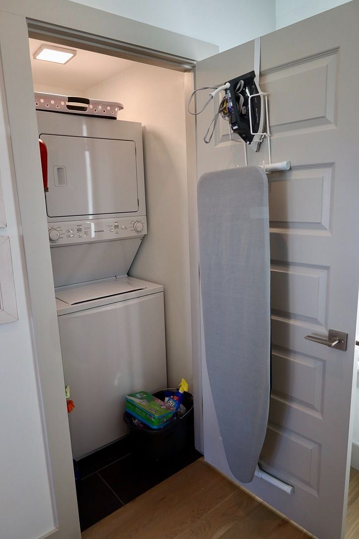 Utility room on main floor with Washer/Dryer and Iron and Ironing Board.