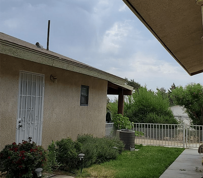 Side door entrance and garden yard