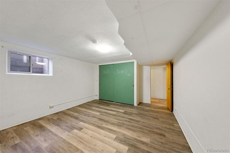 This photo is just to show the CLOSET in the bedroom, It was taken before the egress windows was installed and before the room was furnished. Included just to show how large the closet is (behind the green doors that say "Chalk Board.")