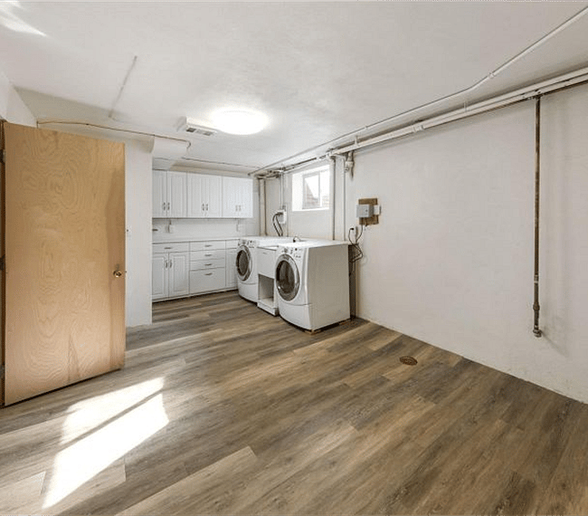 Laundry room, shared with homeowner. Room is equipped with steamer, ironing board, and iron, as well.