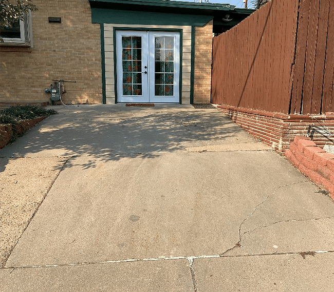 Off-street concrete parking pad dedicated for tenant use.