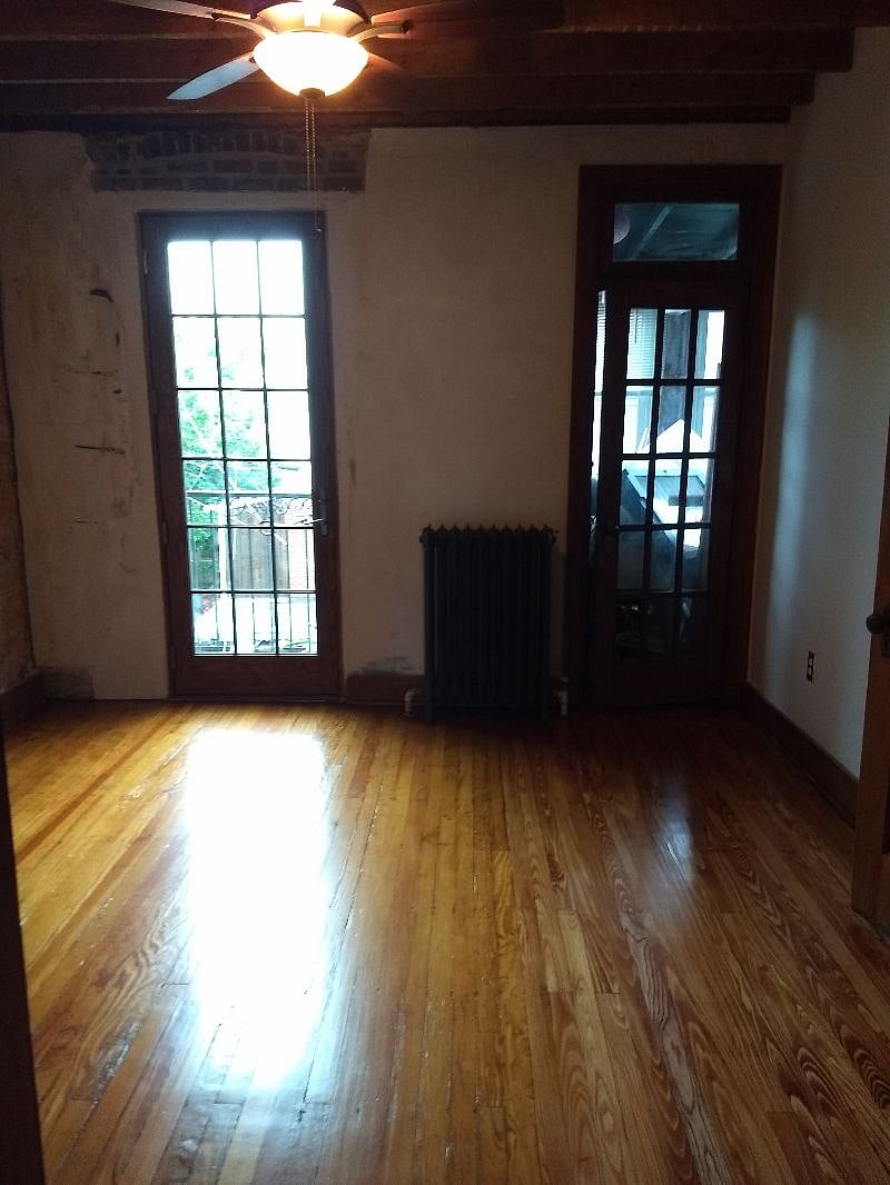 There is a Juliet balcony off the room (left door) and a sun porch/solarium (right door)